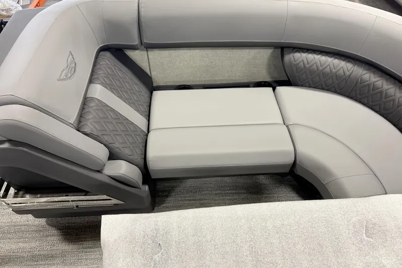 Slide: The Image of 2026 Bennington 22 M Swingback boat seating with gray upholstery and quilted design. - 8
