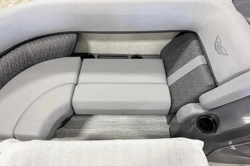 Slide: The Image of Luxurious seating in 2026 Bennington 22 M Swingback pontoon boat, featuring elegant gray upholstery. - 9