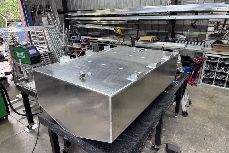 Slide: The Image of Aluminum fuel tank for 1995 Mako 293 Walk Around in a workshop setting. - 12