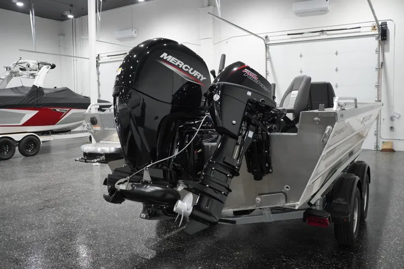 Slide: The Image of 2026 Thunder Jet 209 Rush OT boat with Mercury outboard motor in showroom. - 13