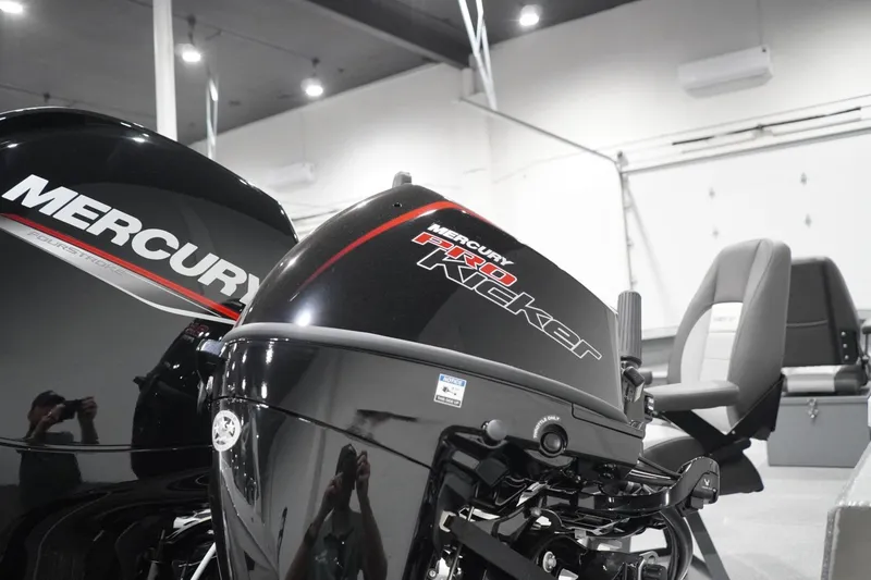 Slide: The Image of 2026 Thunder Jet 209 Rush OT boat with Mercury Pro Kicker engine in showroom. - 14