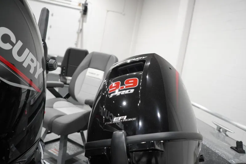 Slide: The Image of 2026 Thunder Jet 209 Rush OT boat interior with Mercury 9.9 Pro outboard motor. - 15