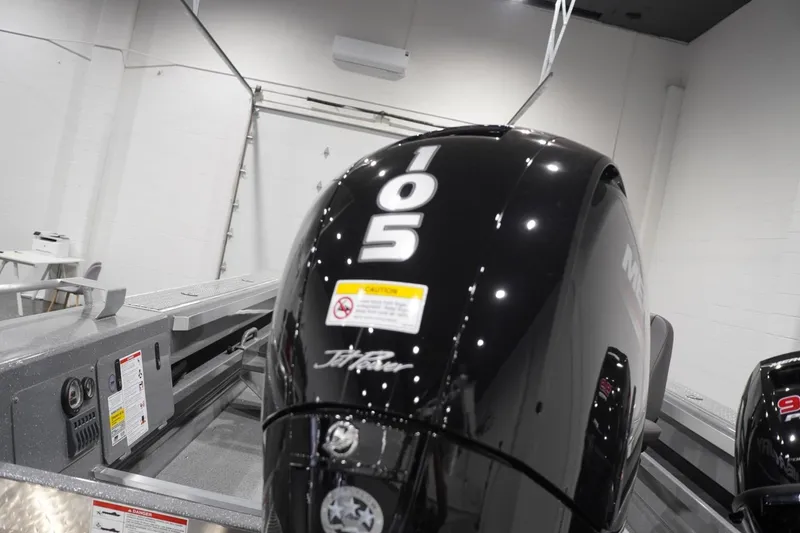 Slide: The Image of 2026 Thunder Jet 209 Rush OT boat engine, featuring a sleek black design with "105" marking. - 16