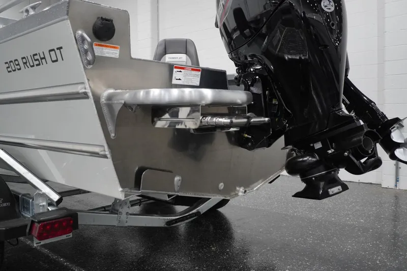 Slide: The Image of 2026 Thunder Jet 209 Rush OT boat with powerful outboard motor, rear view. - 19