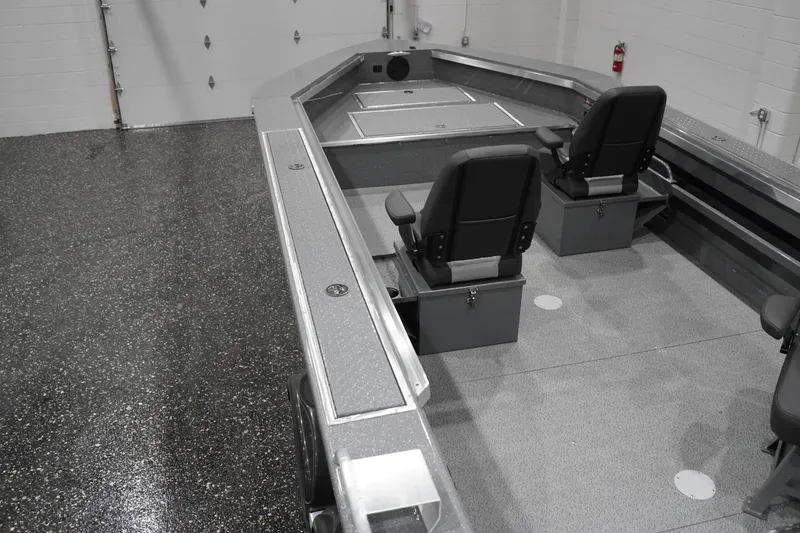 Slide: The Image of Interior of 2026 Thunder Jet 209 Rush OT boat with seating and storage compartments. - 23