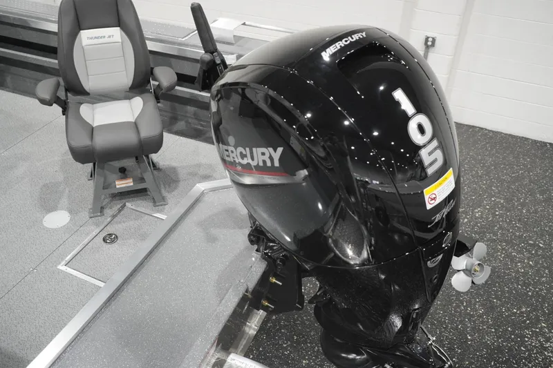 Slide: The Image of 2026 Thunder Jet 209 Rush OT boat interior with Mercury 105 engine and seating. - 24