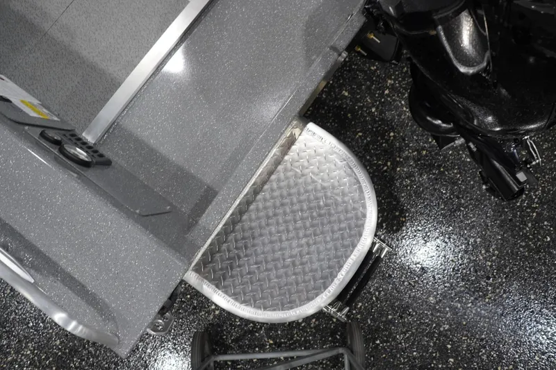 Slide: The Image of 2026 Thunder Jet 209 Rush OT boat with diamond plate step detail. - 26