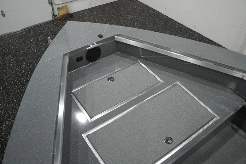 Slide: The Image of Bow storage area of 2026 Thunder Jet 209 Rush OT boat in a garage. - 27