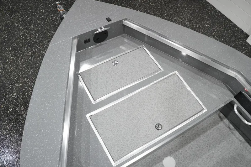 Slide: The Image of 2026 Thunder Jet 209 Rush OT boat interior with storage compartments and sleek design. - 28