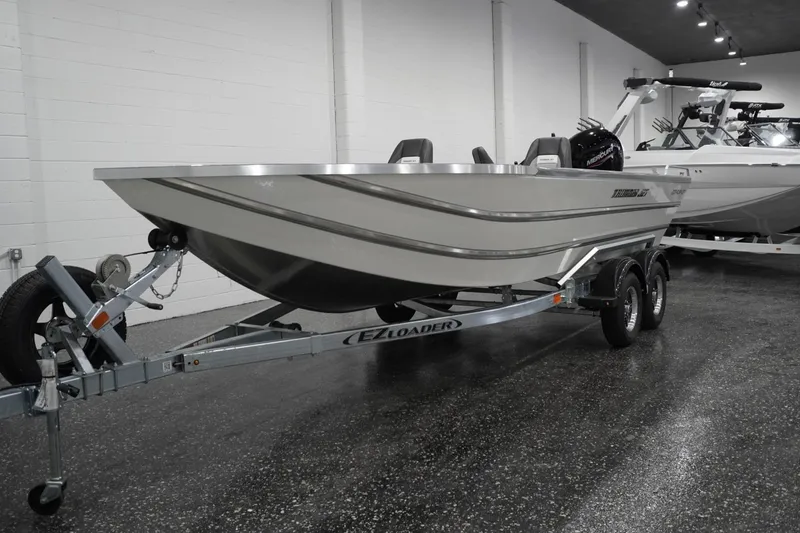 Slide: The Image of 2026 Thunder Jet 209 Rush OT boat on trailer in showroom. - 3