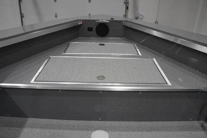 Slide: The Image of Interior view of 2026 Thunder Jet 209 Rush OT boat, featuring storage compartments and sleek design. - 32