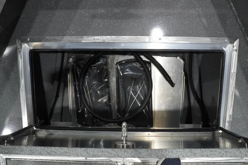 Slide: The Image of 2026 Thunder Jet 209 Rush OT boat interior compartment with wiring and storage space. - 36