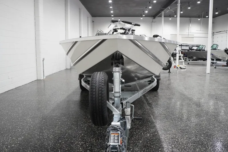 Slide: The Image of 2026 Thunder Jet 209 Rush OT boat on trailer in showroom. - 4