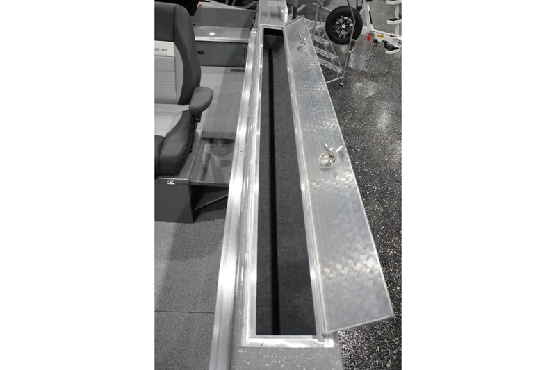 Slide: The Image of 2026 Thunder Jet 209 Rush OT boat interior with open storage compartment and seating. - 42