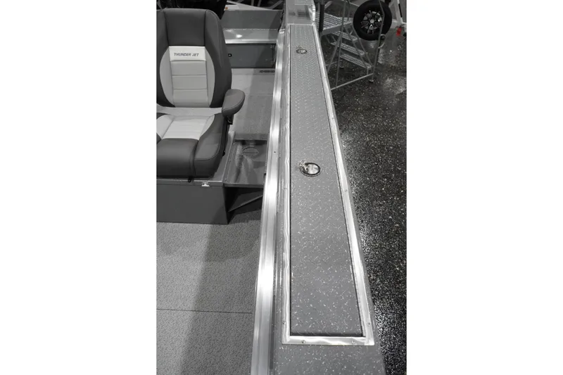 Slide: The Image of Interior view of 2026 Thunder Jet 209 Rush OT boat, featuring seating and storage compartments. - 43