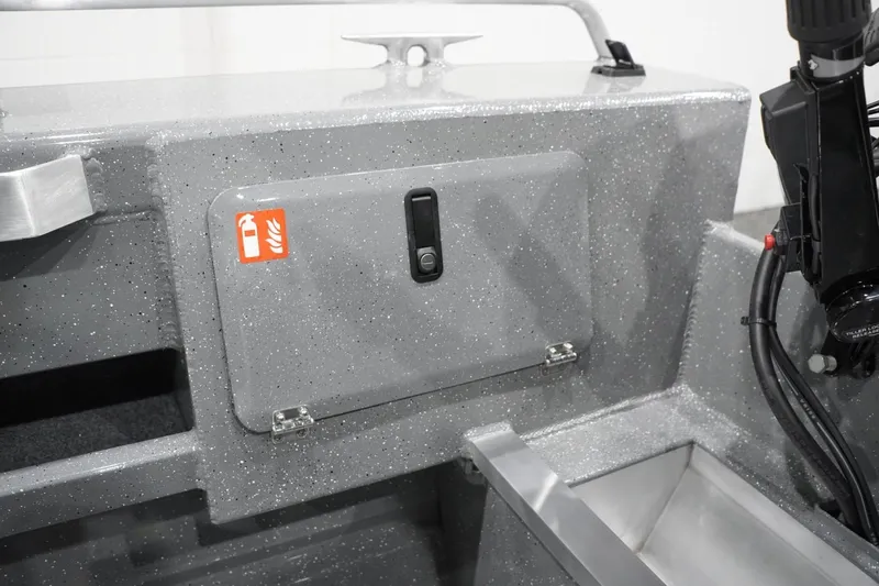 Slide: The Image of 2026 Thunder Jet 209 Rush OT boat interior with fire extinguisher compartment. - 49