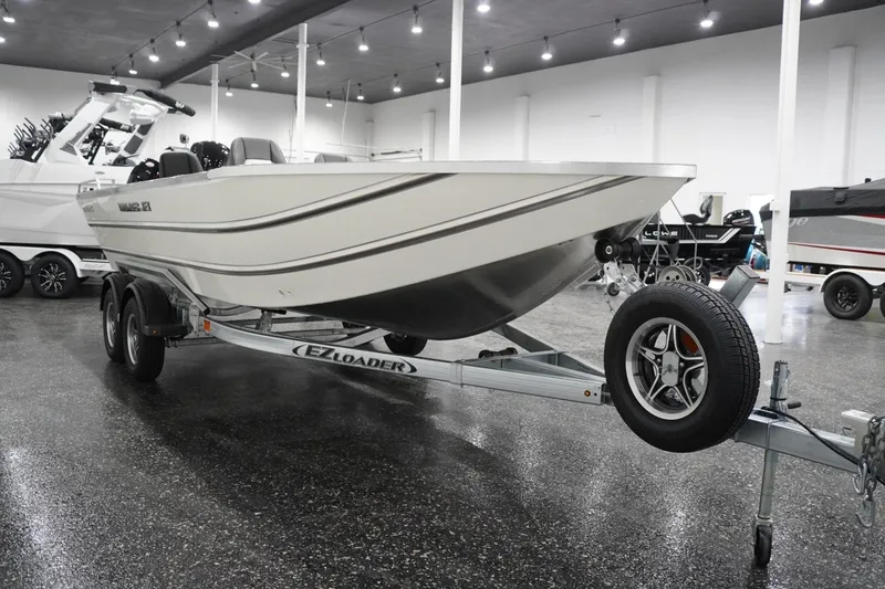 Slide: The Image of 2026 Thunder Jet 209 Rush OT boat on trailer in showroom. - 5
