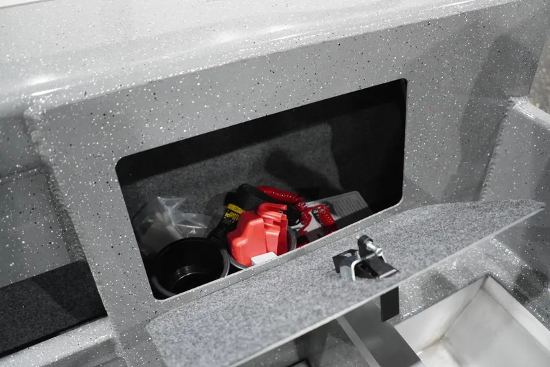 Slide: The Image of Storage compartment in 2026 Thunder Jet 209 Rush OT boat, featuring safety equipment and accessories. - 50