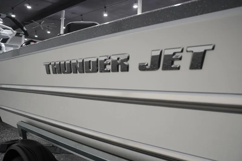 Slide: The Image of 2026 Thunder Jet 209 Rush OT boat with sleek design and bold lettering. - 9