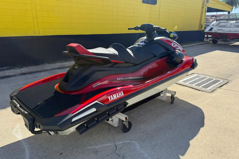 Slide: The Image of 2026 Yamaha WaveRunner VX Cruiser in red, parked outdoors on a sunny day. - 10
