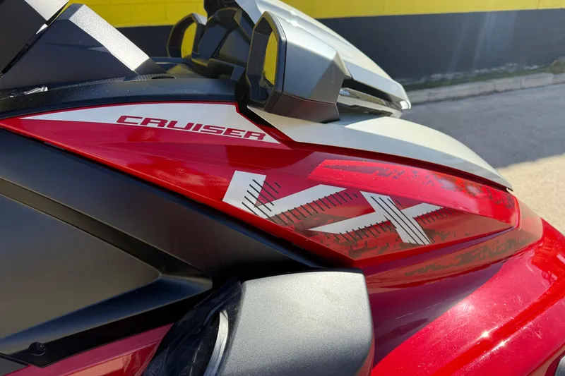 Slide: The Image of 2026 Yamaha WaveRunner VX Cruiser, red and black design, close-up view. - 11