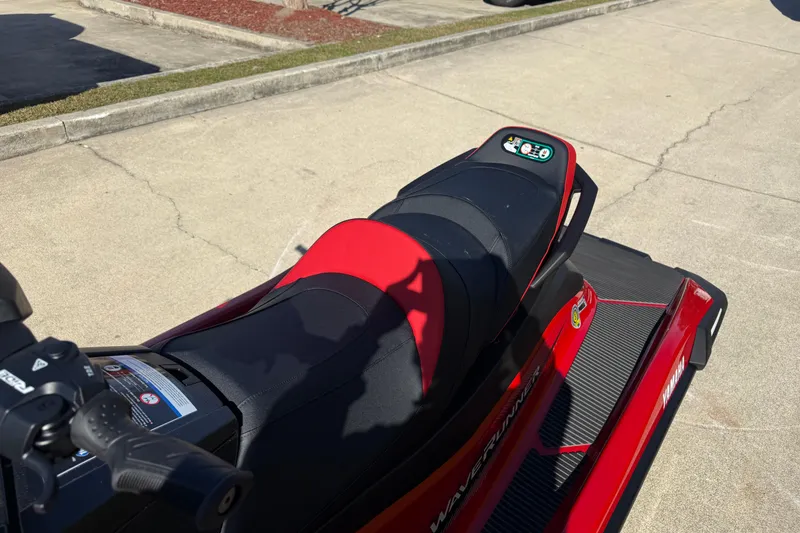 Slide: The Image of 2026 Yamaha WaveRunner VX Cruiser in red, parked on a concrete surface. - 14