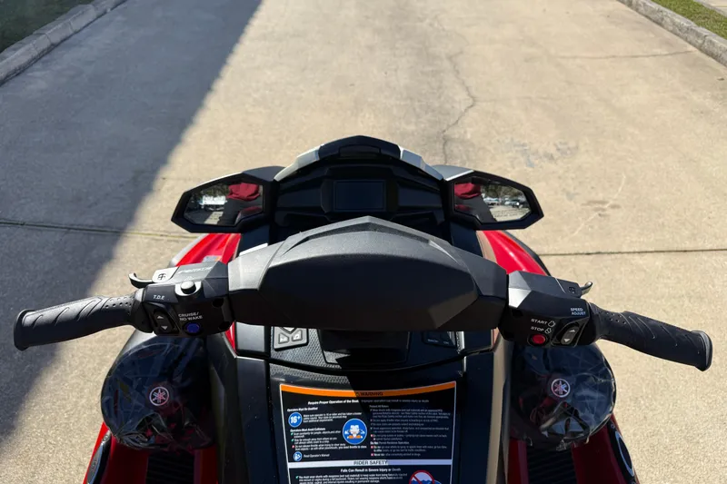 Slide: The Image of 2026 Yamaha WaveRunner VX Cruiser handlebars and dashboard, showcasing controls and safety instructions. - 15
