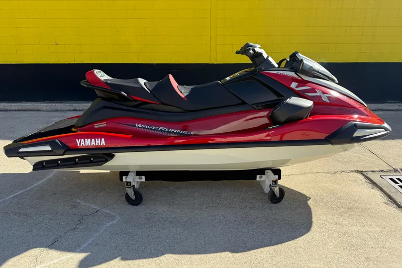 Slide: The Image of 2026 Yamaha WaveRunner VX Cruiser in red and black, displayed outdoors on a stand. - 3