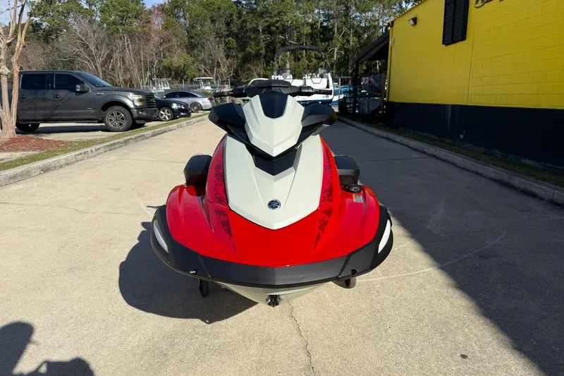 Slide: The Image of 2026 Yamaha WaveRunner VX Cruiser in vibrant red, parked outdoors on a sunny day. - 5