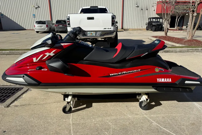 Slide: The Image of 2026 Yamaha WaveRunner VX Cruiser in red, parked outdoors on a sunny day. - 7