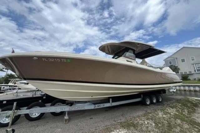 The Image of 2024 Chris-Craft Catalina 30 boat on trailer under cloudy sky. - 1