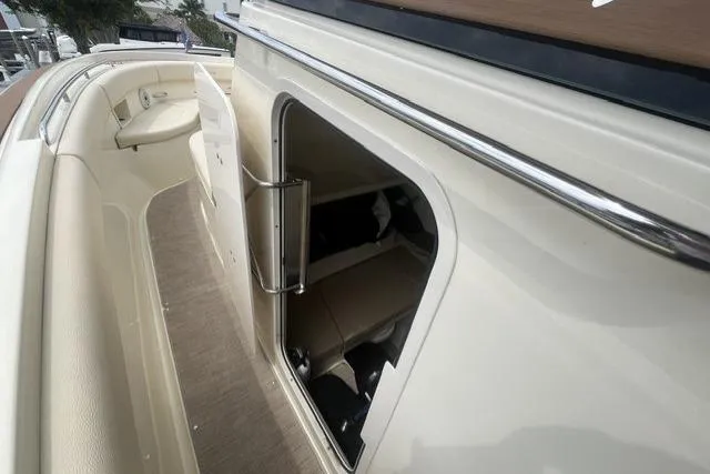 Slide: The Image of 2024 Chris-Craft Catalina 30 boat interior with open cabin door, showcasing sleek design. - 10