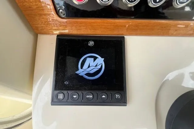 Slide: The Image of 2024 Chris-Craft Catalina 30 dashboard with digital display and control buttons. - 12