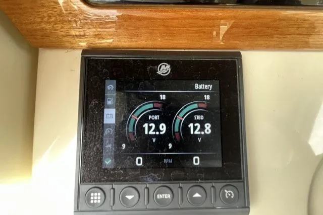 Slide: The Image of Digital display on 2024 Chris-Craft Catalina 30 showing battery voltage levels. - 13