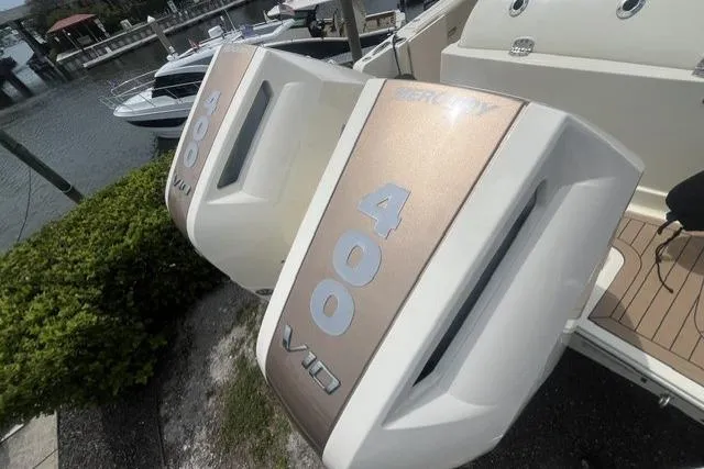 Slide: The Image of 2024 Chris-Craft Catalina 30 with twin Mercury 400 V10 outboard engines at a marina. - 15
