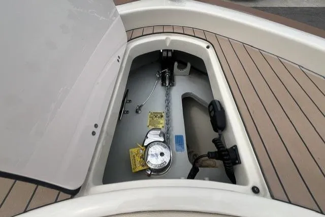 Slide: The Image of 2024 Chris-Craft Catalina 30 anchor compartment with teak decking and chain storage. - 17