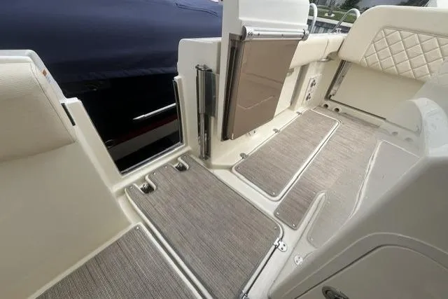 Slide: The Image of 2024 Chris-Craft Catalina 30 interior with elegant flooring and seating details. - 18
