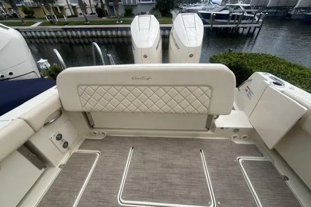 Slide: The Image of 2024 Chris-Craft Catalina 30 boat interior with quilted seating and twin outboard engines. - 21