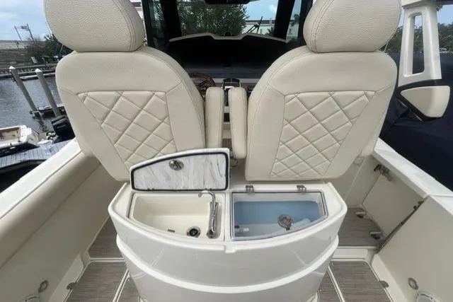 Slide: The Image of 2024 Chris-Craft Catalina 30 boat interior with luxurious seating and storage compartments. - 24