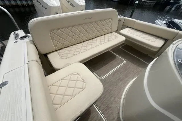 Slide: The Image of 2024 Chris-Craft Catalina 30 boat interior with beige quilted seating. - 26