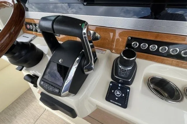 Slide: The Image of Control panel of 2024 Chris-Craft Catalina 30, featuring modern navigation and throttle controls. - 5