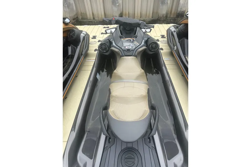 Slide: The Image of 2022 Sea-Doo GTX Limited 300 jet ski with beige seat and sleek design. - 4