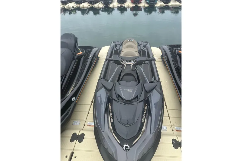 Slide: The Image of 2022 Sea-Doo GTX Limited 300 jet ski docked on calm water. - 9