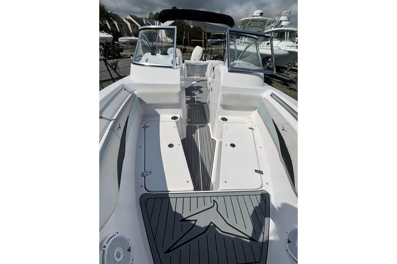 Slide: The Image of 2016 PROLINE 23DC boat interior with sleek design and spacious seating area. - 5