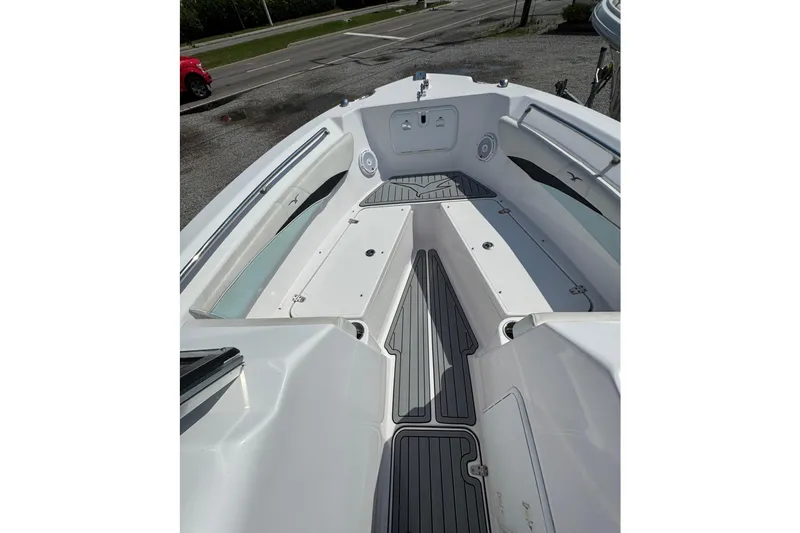 Slide: The Image of 2016 PROLINE 23DC boat interior with sleek seating and storage compartments. - 6