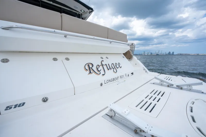 Slide: The Image of 2017 Sea Ray Sundancer 510 yacht on water, overcast sky, Longboat Key, Florida. - 11