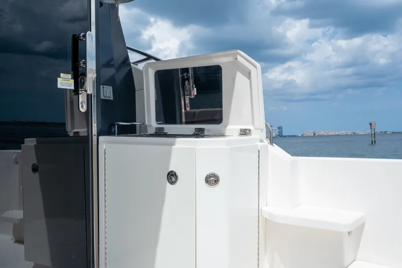 Slide: The Image of 2017 Sea Ray Sundancer 510 yacht deck with sleek cabinetry and ocean view. - 13