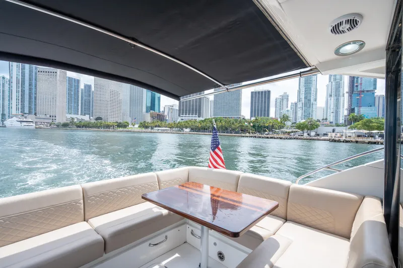 Slide: The Image of 2017 Sea Ray Sundancer 510 yacht interior with city skyline view. - 14
