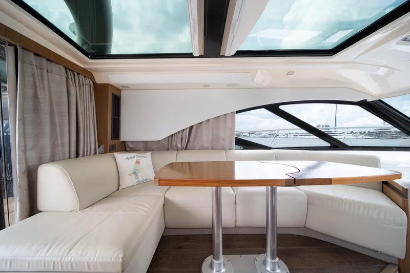 Slide: The Image of Luxurious interior of 2017 Sea Ray Sundancer 510 yacht with plush seating and wooden table. - 20