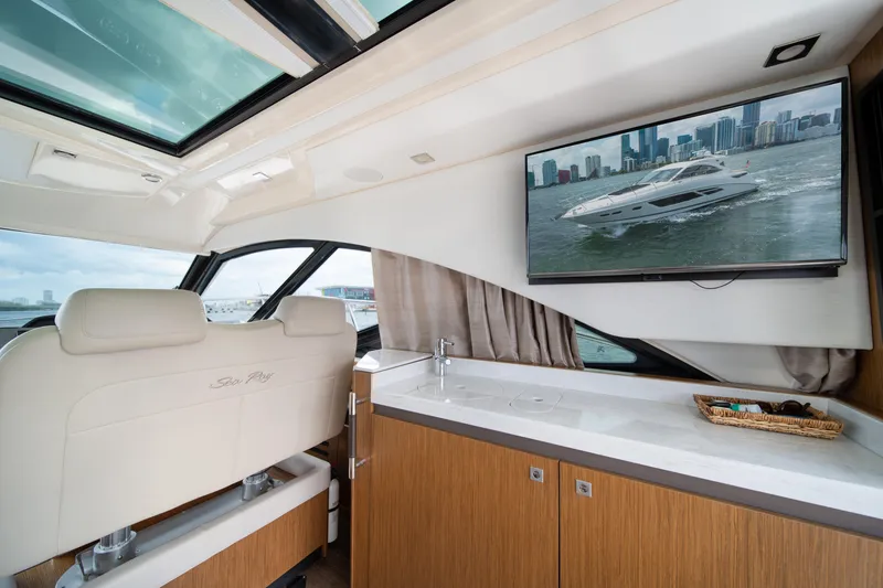 Slide: The Image of Luxurious interior of 2017 Sea Ray Sundancer 510 yacht with TV and panoramic windows. - 21